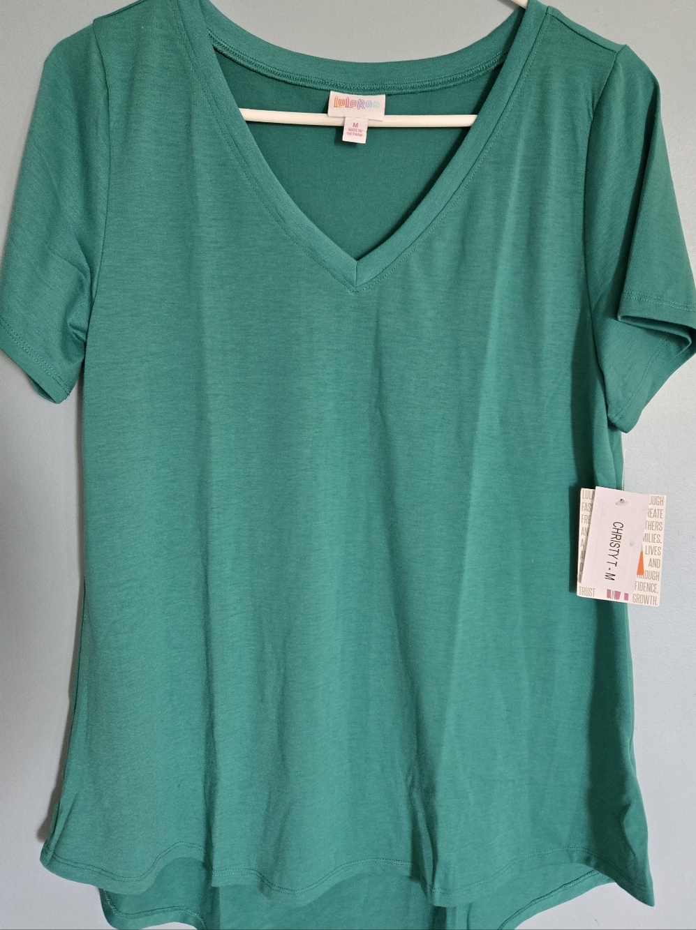 LuLaRoe Christy V-Neck Short Sleeve Tee in Teal Green Hem Is Slightly Hi-Low Md.